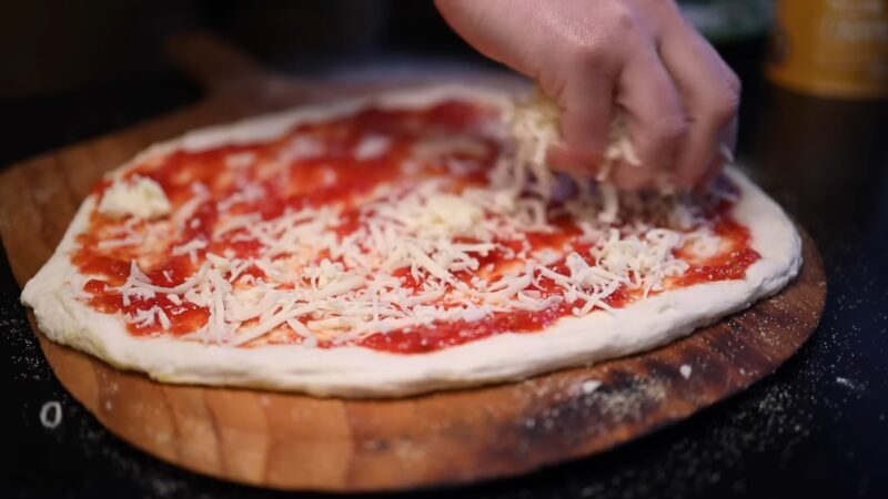Place mozzarella cheese on the pizza
